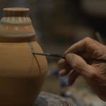 Giorgi Tatulashvili painting a vase
